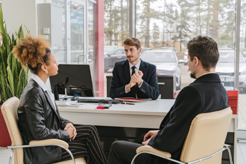 A public adjuster talking to a couple of clients